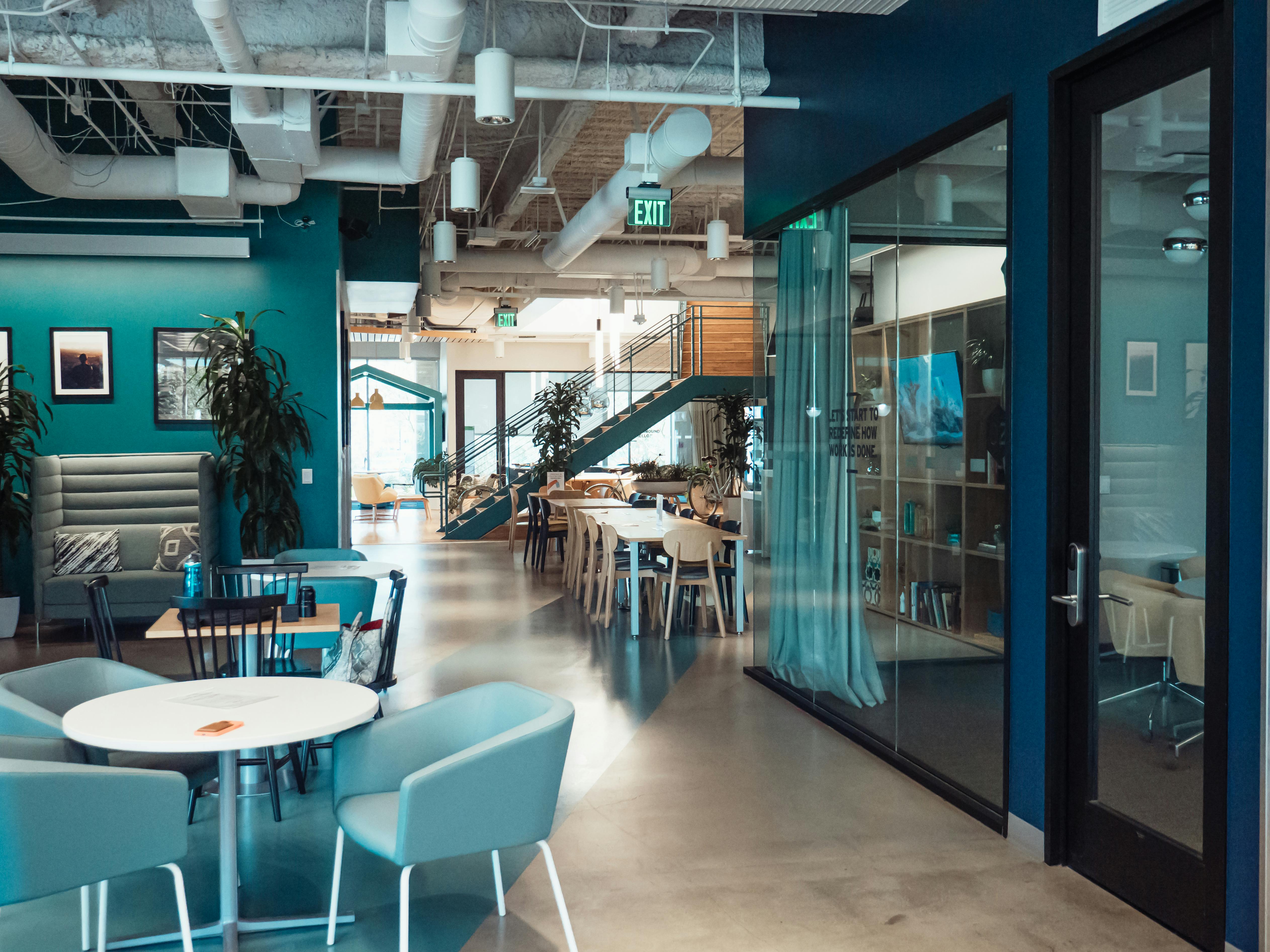office space with blue walls and furniture 